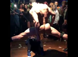 Muscular masculine stripper dancing in