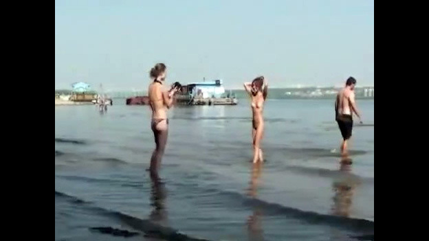 Nude damsels on the beach for swingers