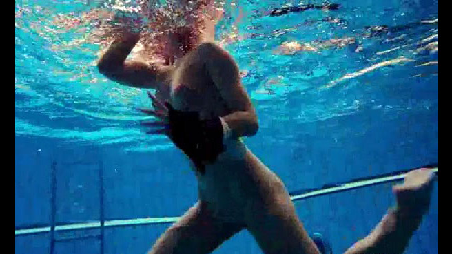 Porno shooting underwater. Naked..